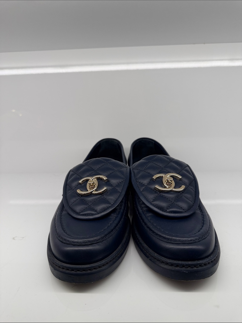 CHANEL Navy Quilted Leather Slip-On Loafers with Gold CC Emblem